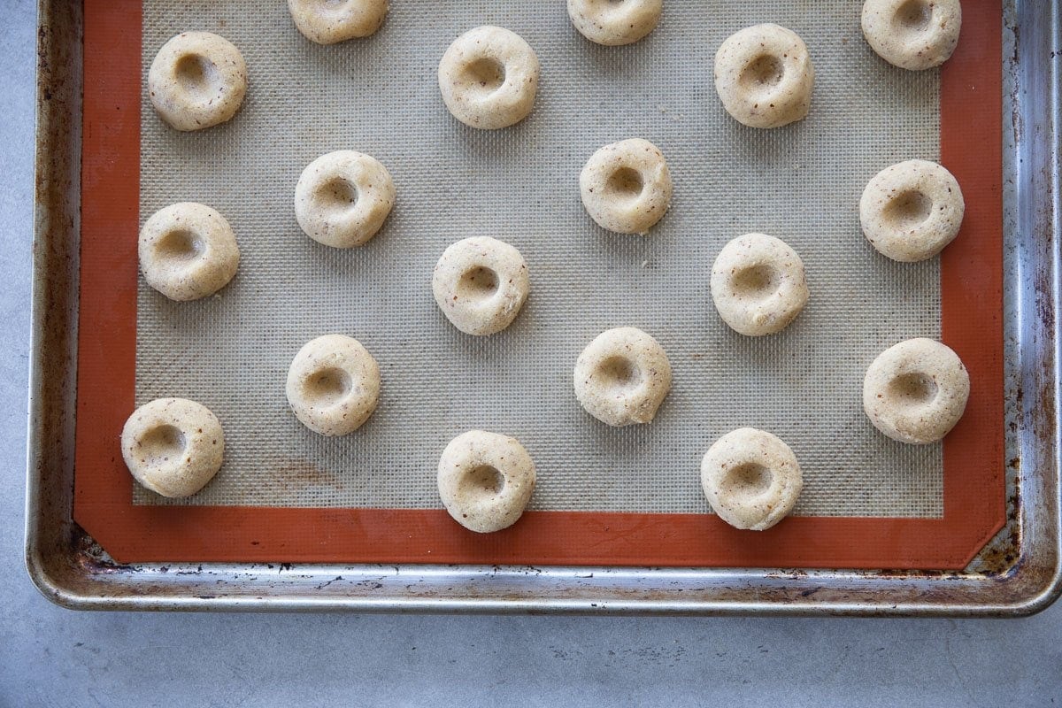 Press your thumb in the middle of each biscuit to create a soft indent.