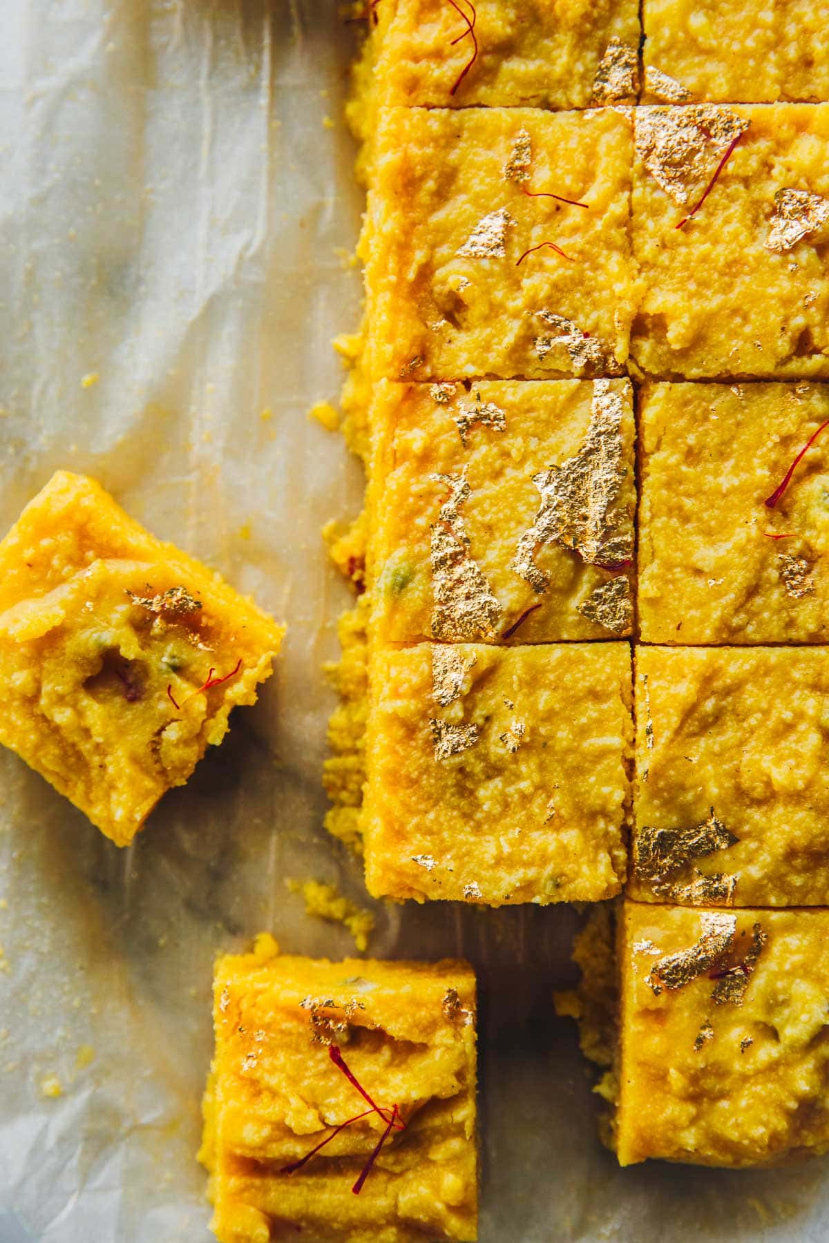 Microwave Mango Barfi pieces cut into 2 inch squares.