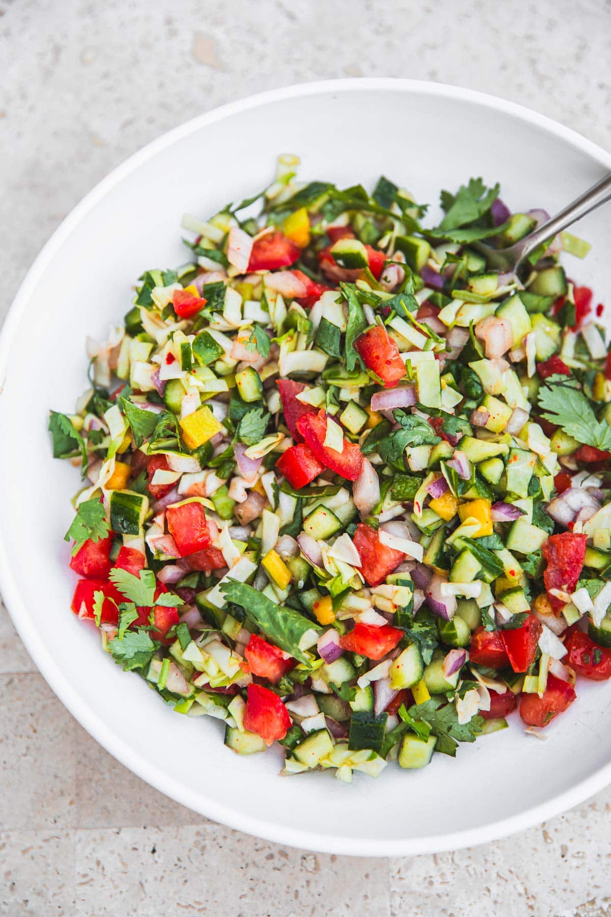 Kachumber Salad in a white bowl.