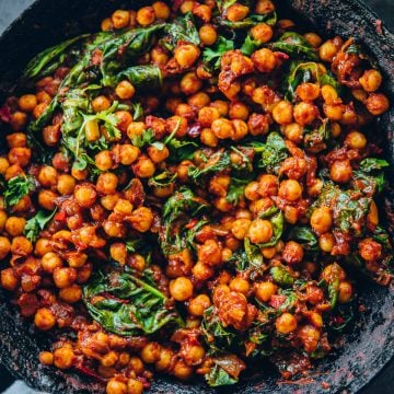 Spicy Moroccan Chickpeas With Spinach in a pan.