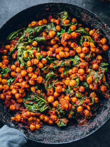 Spicy Moroccan Chickpeas With Spinach in a pan.