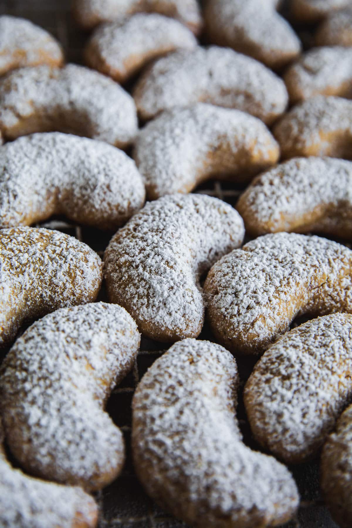 Kourabiedes - crescent shaped Greek Christmas cookies dusted with icing sugar.