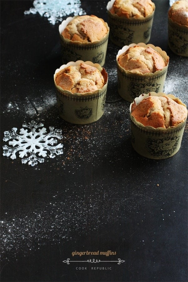 Gingerbread Muffins on a black table with Christmas decorations.
