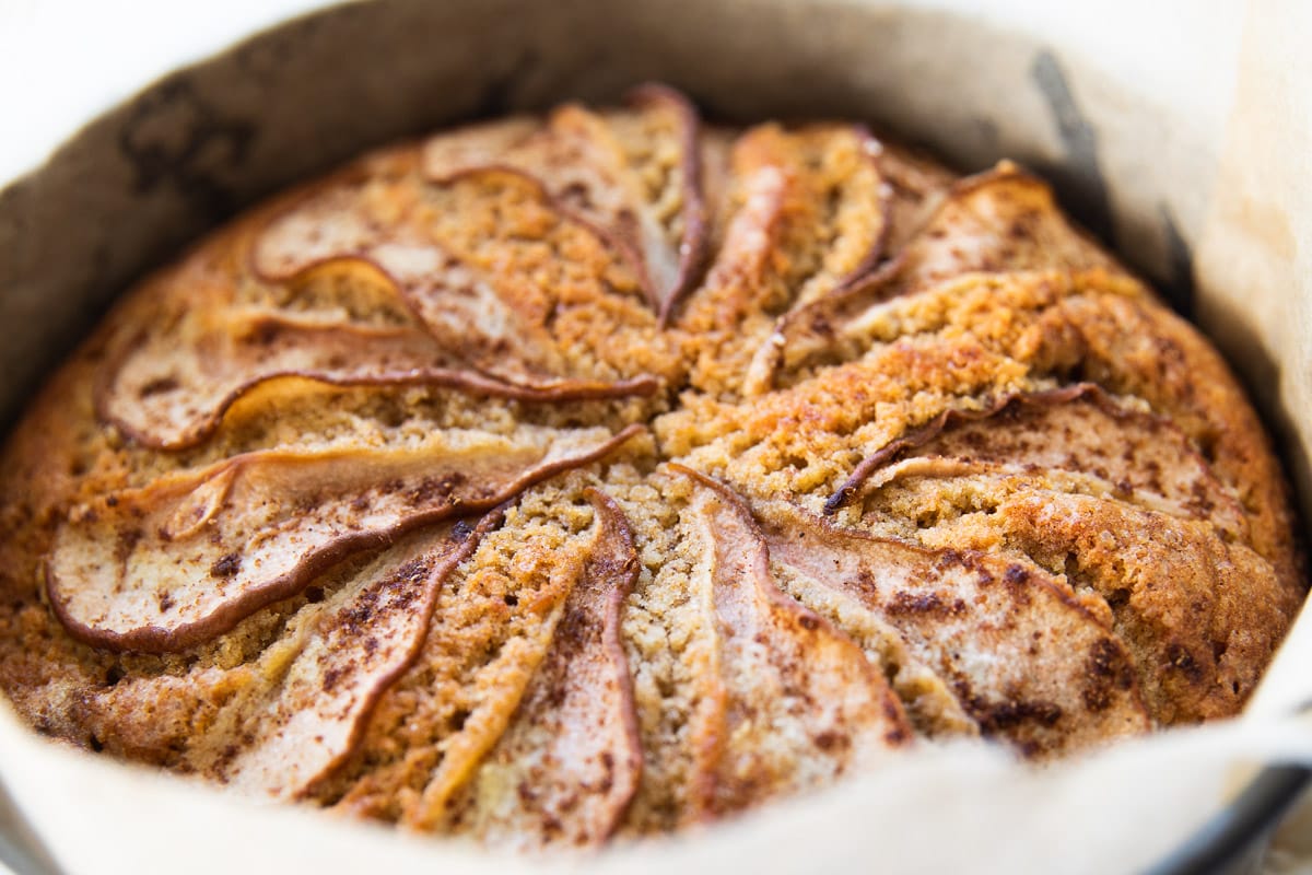 Freshly baked spiced pear cake cooling in the cake tin.