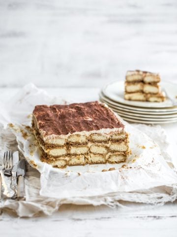 Gingerbread Tiramisu served with plates and cutlery.