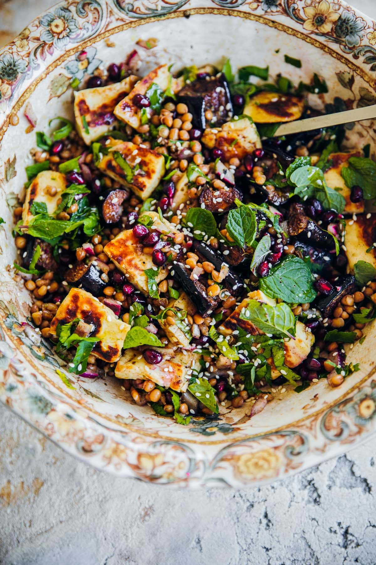 Halloumi, Lentil And Roasted Eggplant Salad in a floral vintage bowl.