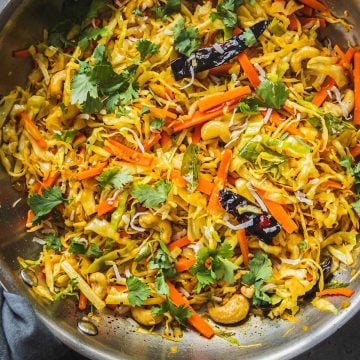 Cabbage Thoran in a large stainless steel frying pan.