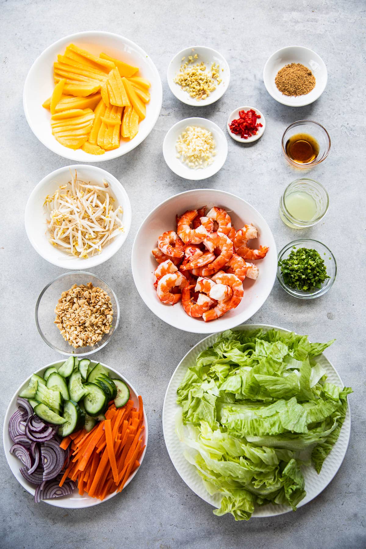 Thai Prawn Mango Salad Ingredients measured in bowls.