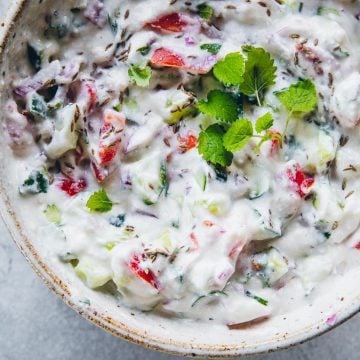 Basic Indian vegtable and yoghurt raita served in a bowl