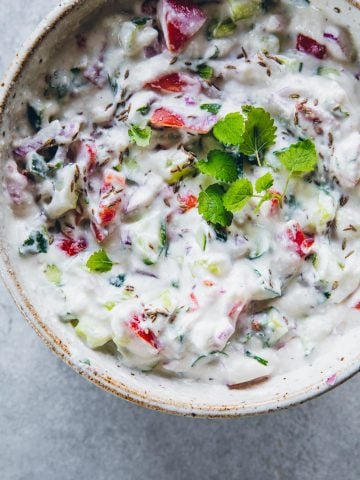 Basic Indian vegtable and yoghurt raita served in a bowl