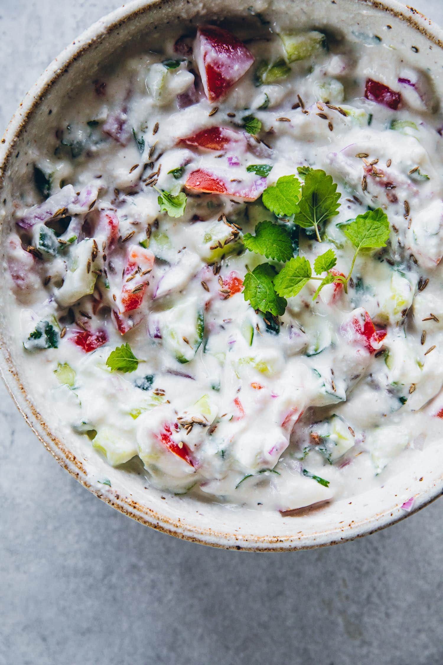 Basic Indian vegtable and yoghurt raita served in a bowl