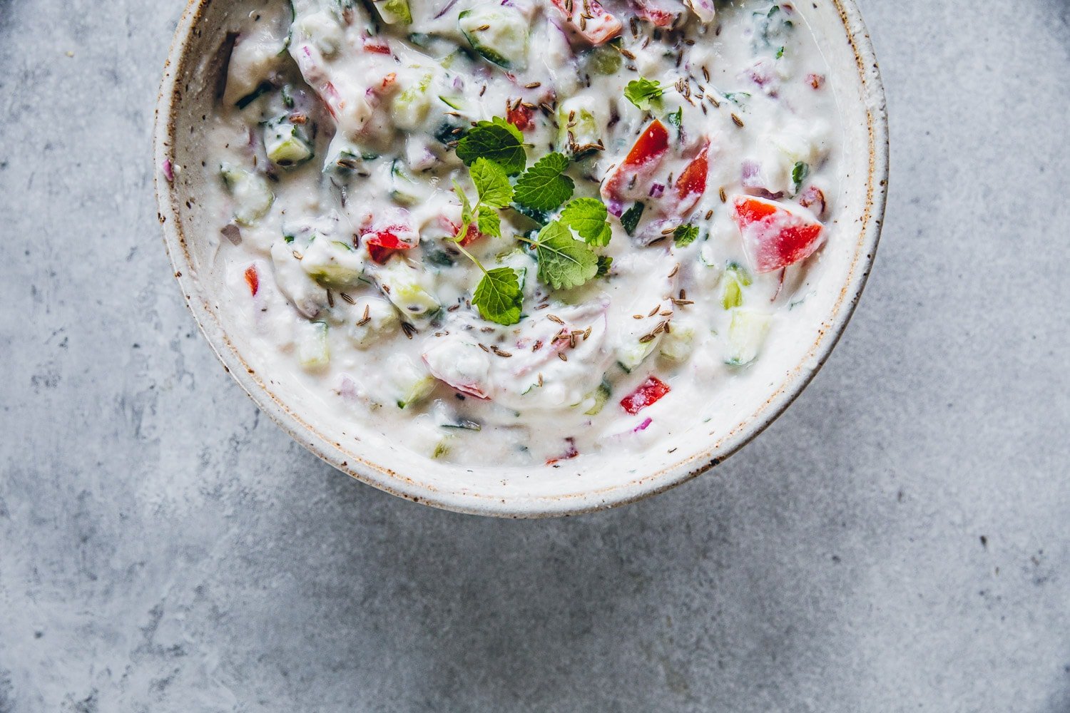 Chopped vegetable raita served in a bowl