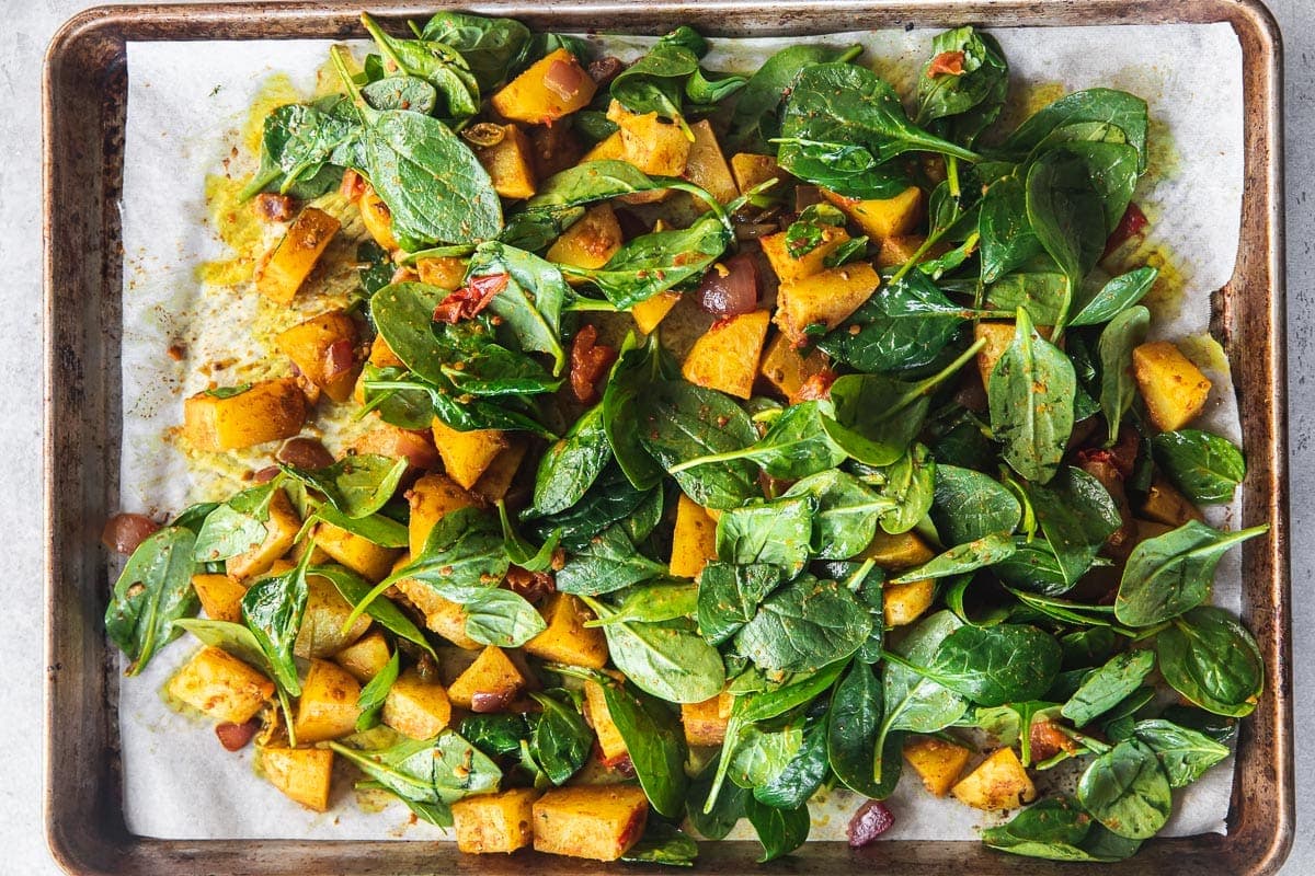 Add spinach and water to the tray