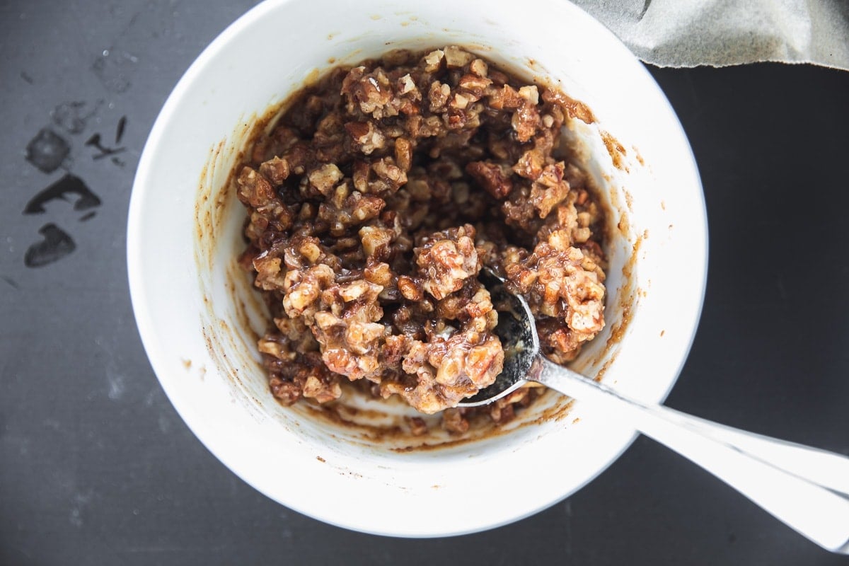 Make Pecan Crumble by mixing ingredients for it in a bowl. 