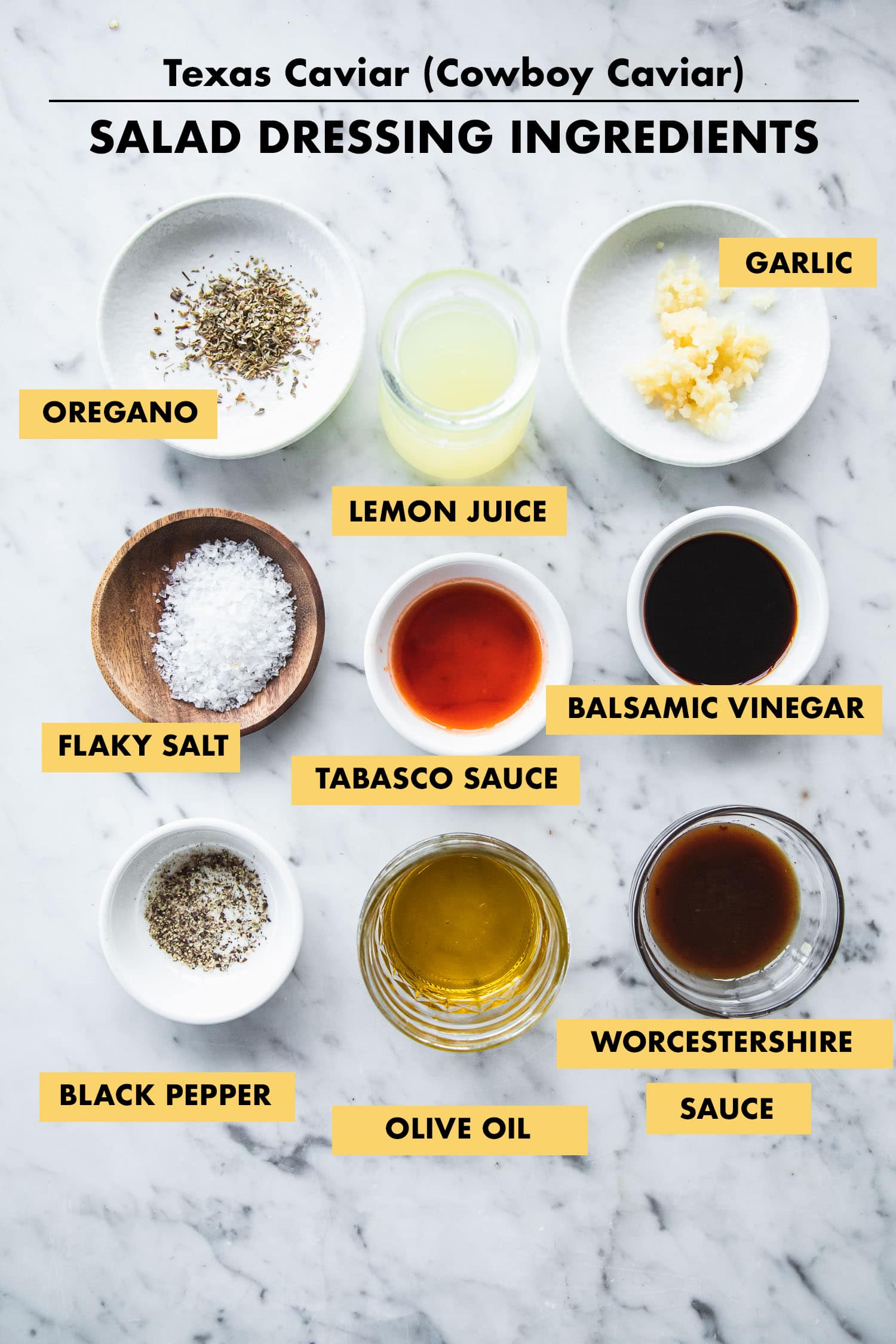 Ingredients for the Texas Caviar salad dressing measured in bowls on a tabletop