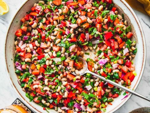 Texas Caviar (Cowboy Caviar) served in a bowl with corn chips and margarita