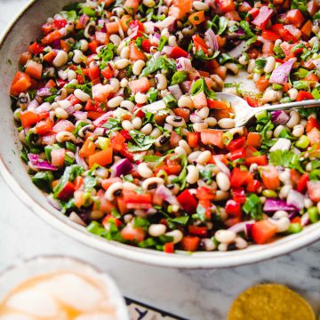 Texas Cowboy Caviar served in a large platter with corn chips