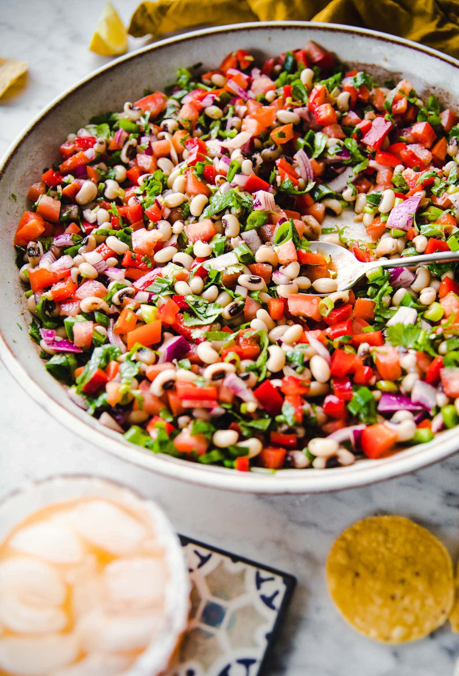 Texas Cowboy Caviar served in a large platter with corn chips