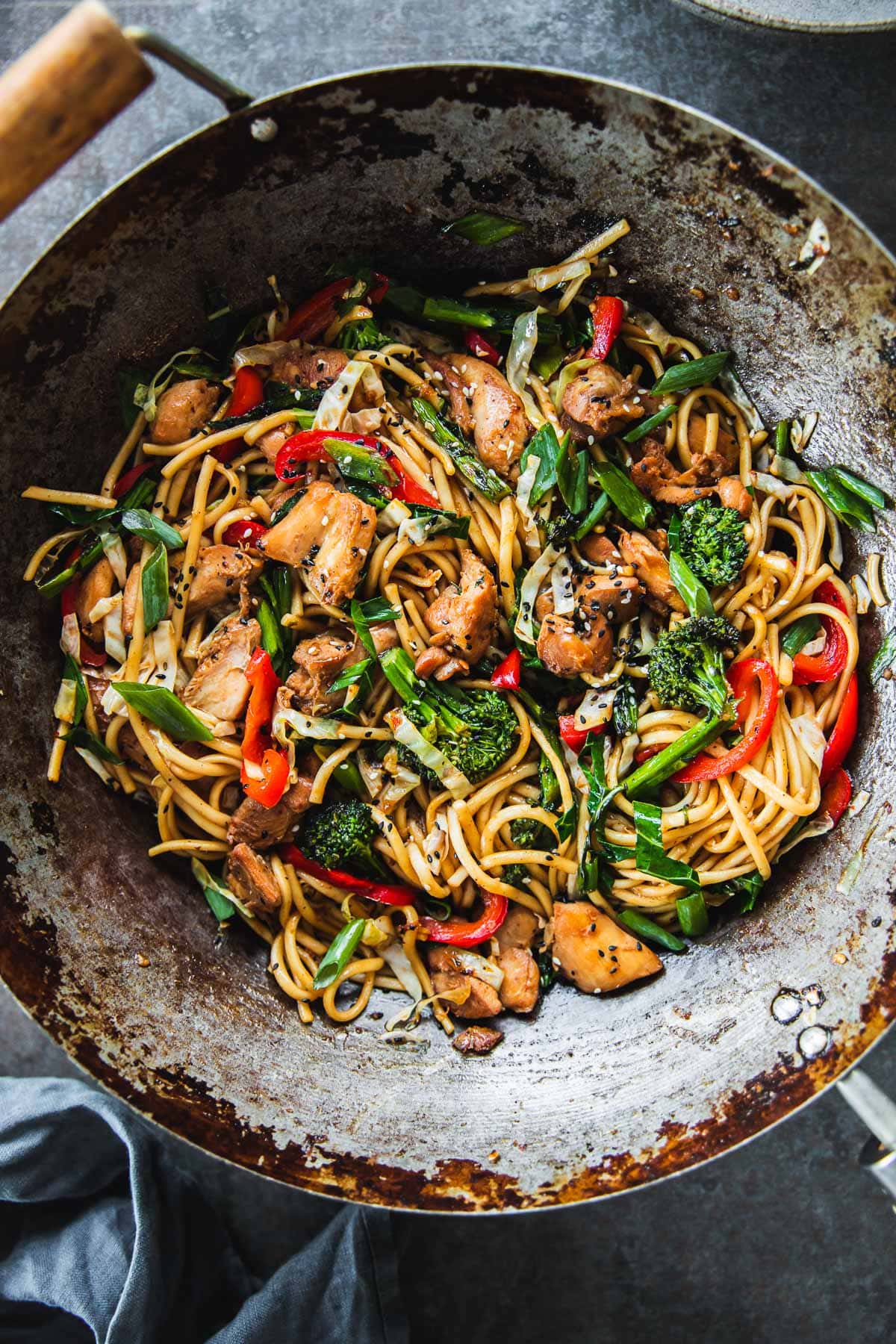 Chicken Udon Noodle stir-fry in a carbon steel wok.