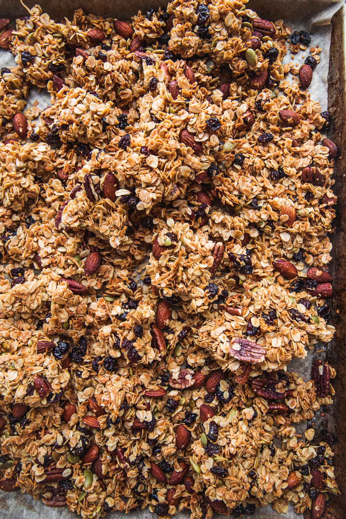Homemade healthy granola clusters baked in a baking tray.
