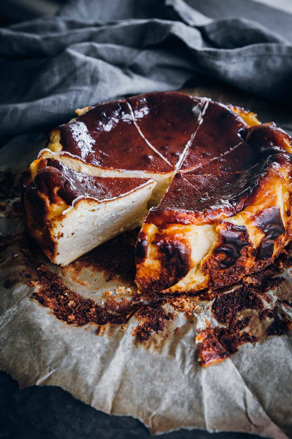 Burnt Basque Cheesecake slices on a baking paper.