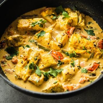 Sri Lankan Fish Curry served in a wide pan.