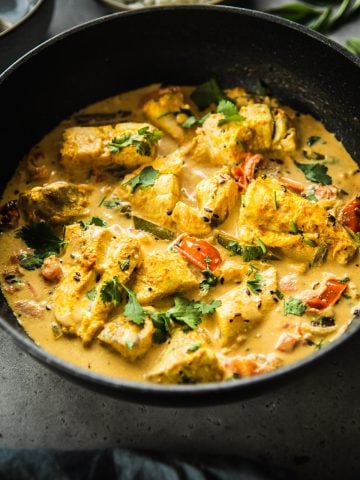 Sri Lankan Fish Curry served in a wide pan.