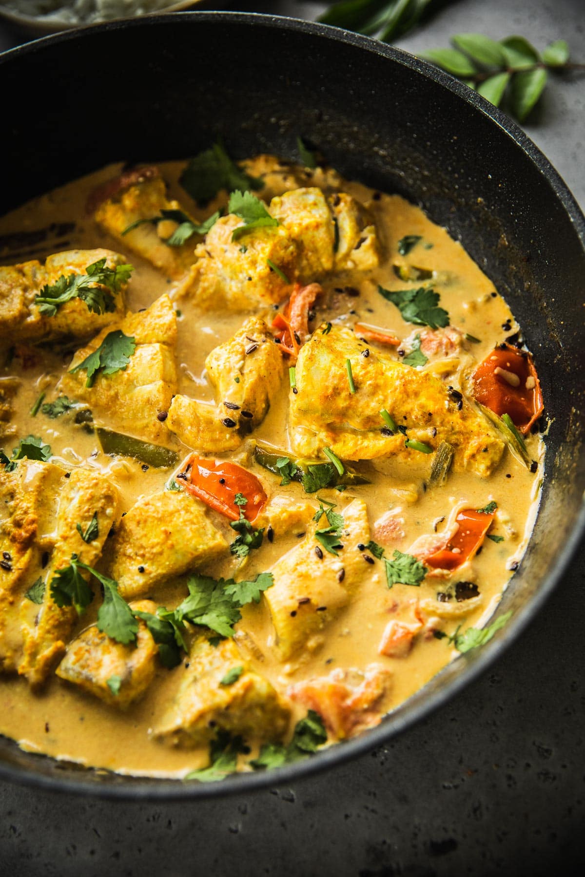 Golden yellow Sri Lankan Fish Curry with Barramundi fish.