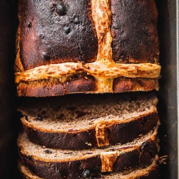 Hot Cross Bun Loaf slices in a baking tin.