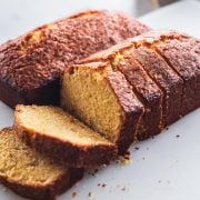 Orange Pound Cake loaves on a white table.