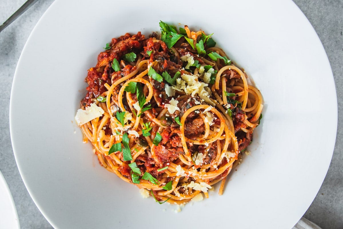 Serve sardine pasta with fresh parsley and grated parmesan cheese.