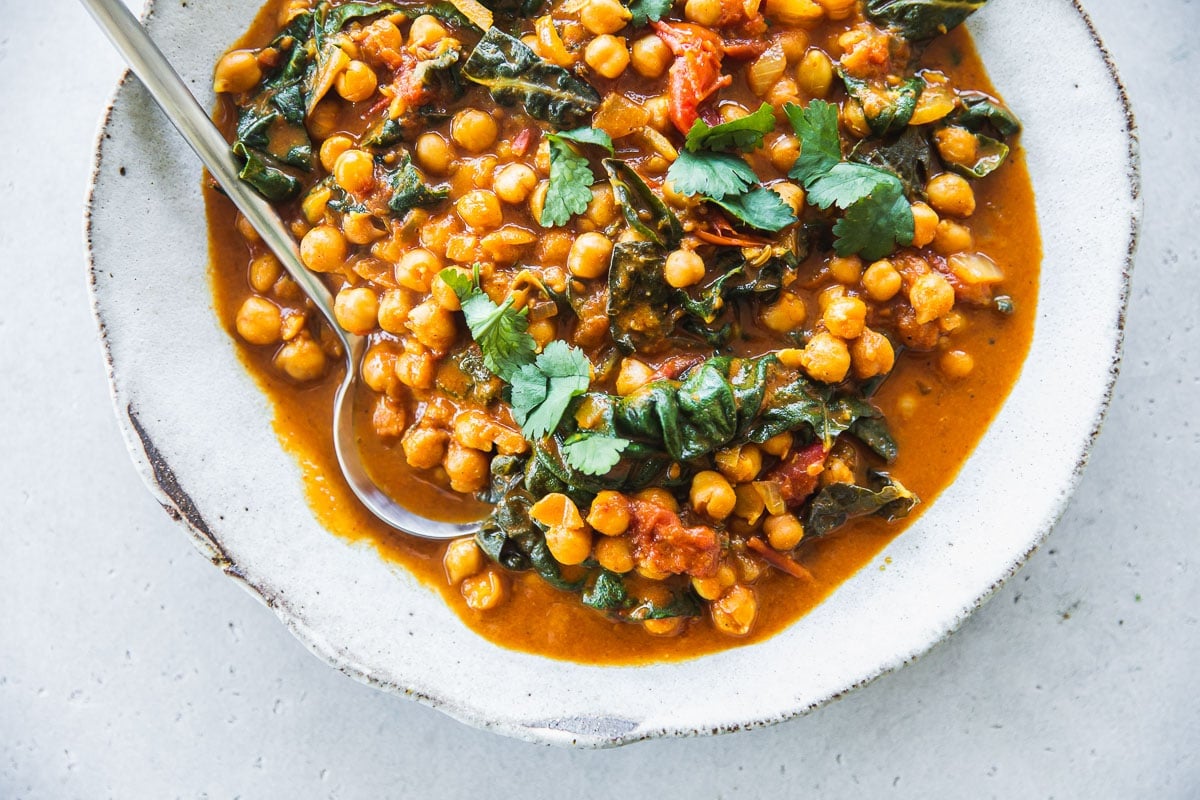 Silverbeet Chickpea Curry in a white bowl.
