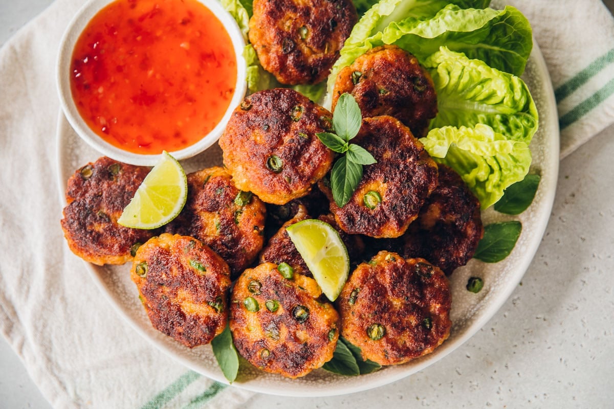 Serve Thai Fish Cakes with sweet chilli sauce and Cos lettuce leaves.