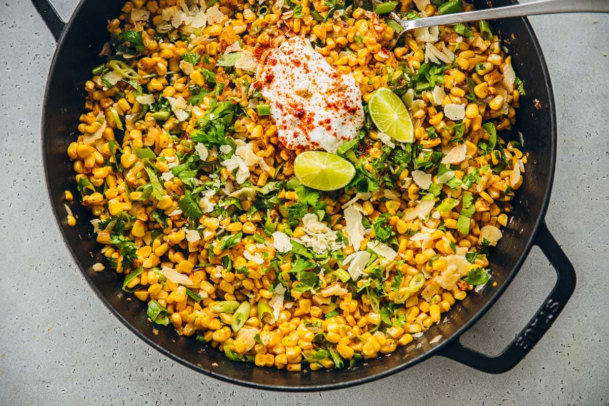 Mexican Corn Salad served in a cast-iron pan.