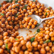 Sauteed Spicy Chickpeas scooped with a sppon.