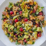 Mexican Chicken Salad in a white bowl with serving spoon.