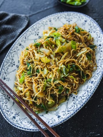 Panda Express Chow Mein Noodles served in a vintage, blue, floral, oval platter; chopsticks on the side