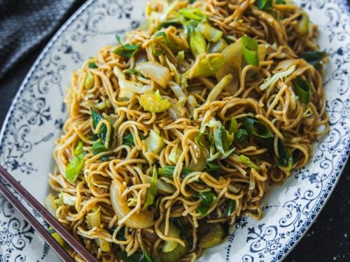 Panda Express Chow Mein Noodles served in a vintage, blue, floral, oval platter; chopsticks on the side