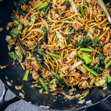 Minced pork noodles in a hot wok.