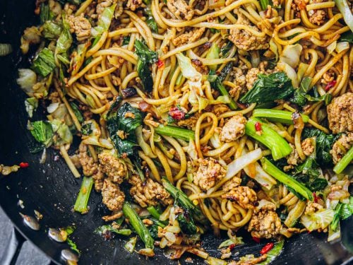 Minced pork noodles in a hot wok.