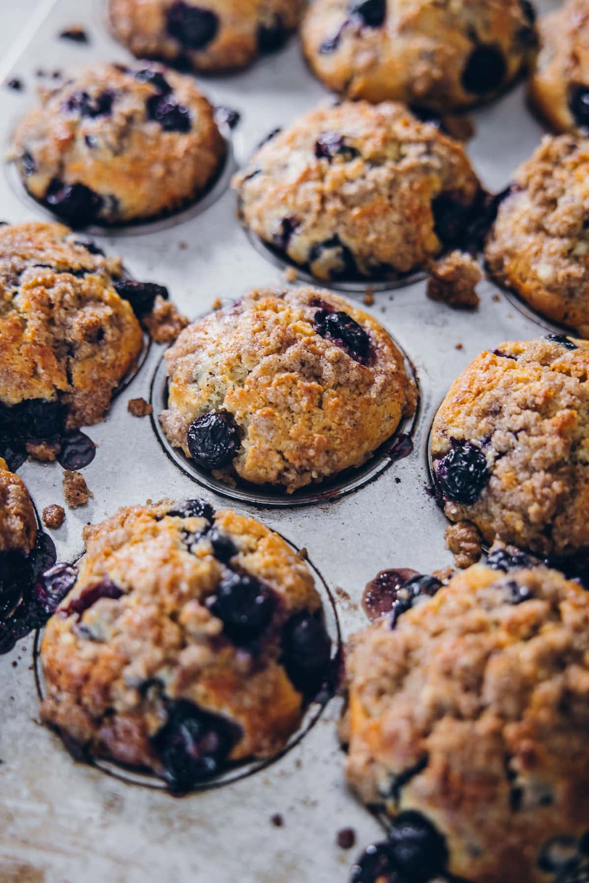 Buttermilk Blueberry Muffins in a muffin tin.